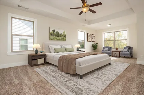 a bedroom with a bed and glass window