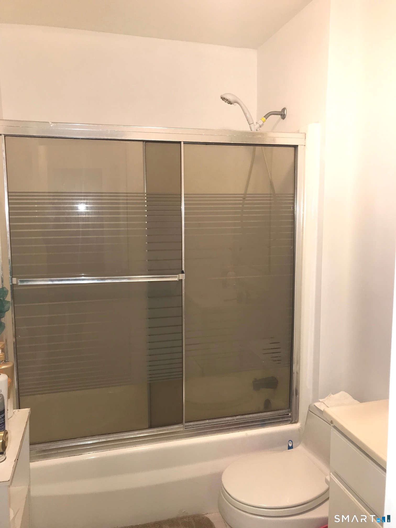 175 Mill Pond Road, Unit 346 Hamden, CT 06514 - Photo 12 of 18 a bathroom with a toilet and shower