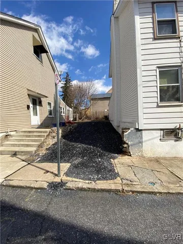 a view of a street with big house
