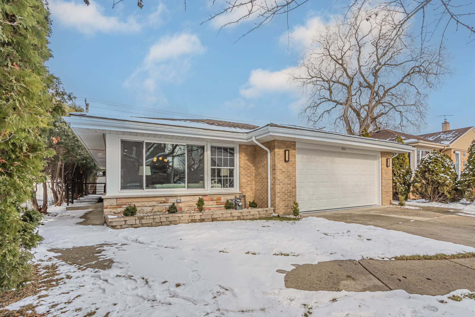 1814 Oakton Street Park Ridge, IL 60068 - Photo 1 of 30 a front view of a house with a garden and patio