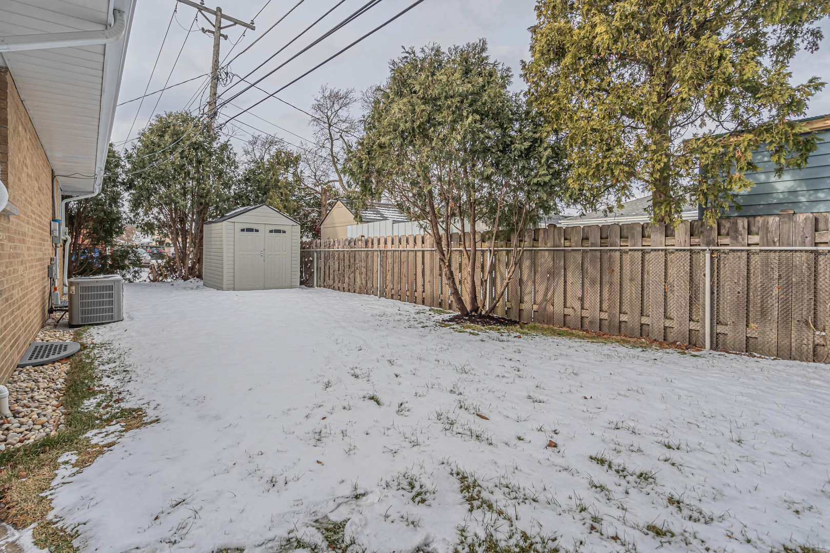1814 Oakton Street Park Ridge, IL 60068 - Photo 29 of 30 a view of a house with wooden fence