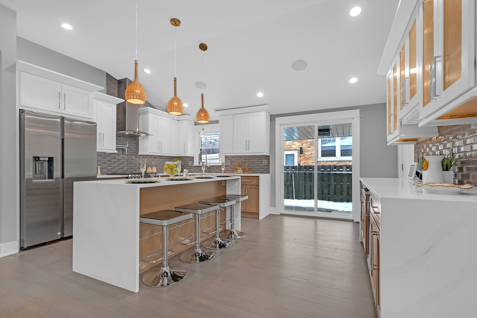 1814 Oakton Street Park Ridge, IL 60068 - Photo 9 of 30 a large kitchen with kitchen island a large counter top space a sink stainless steel appliances and cabinets