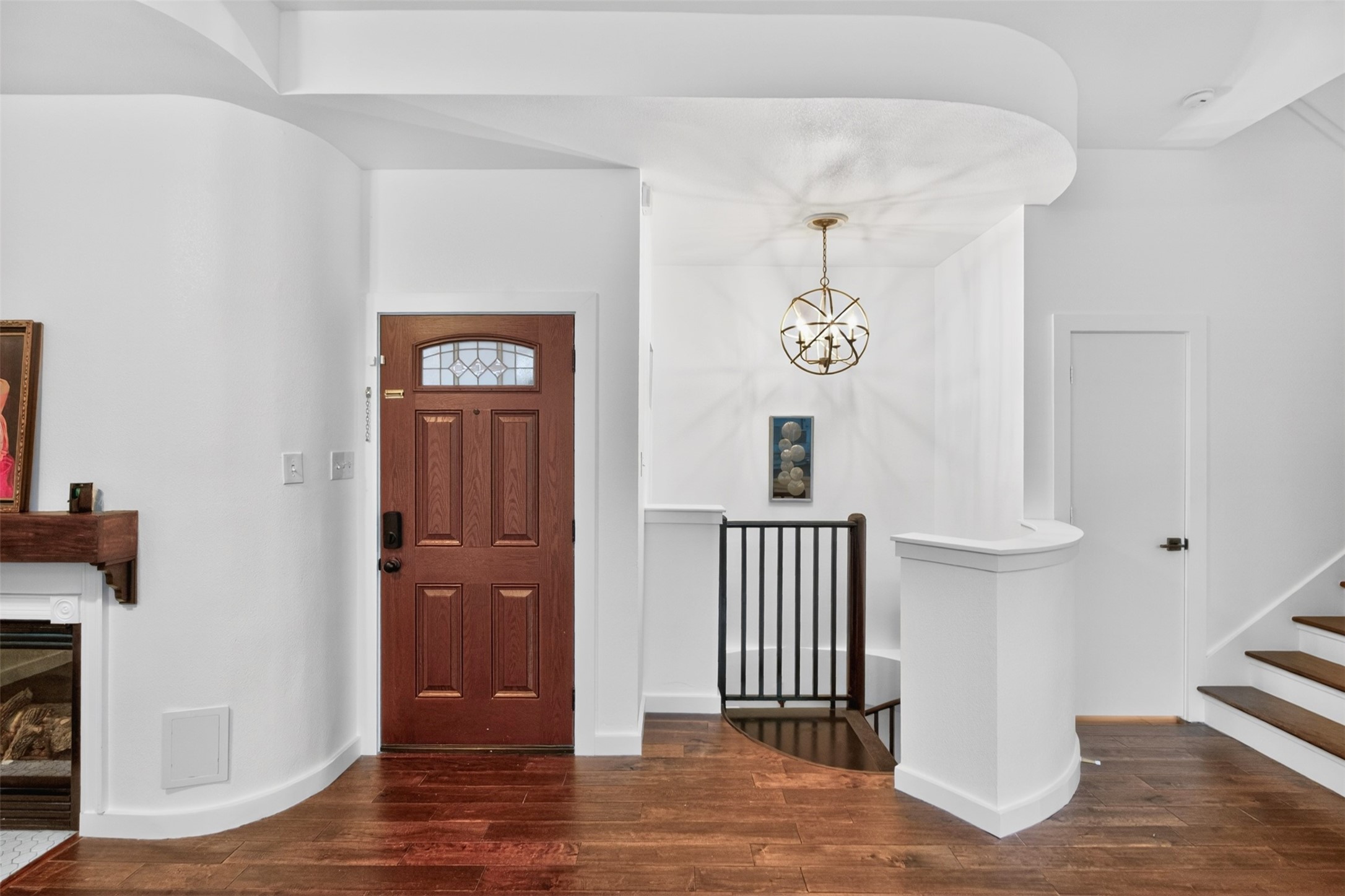2716 Bagby Street Houston, TX 77006 - Photo 12 of 29 a view of a hallway with elevator and wooden floor