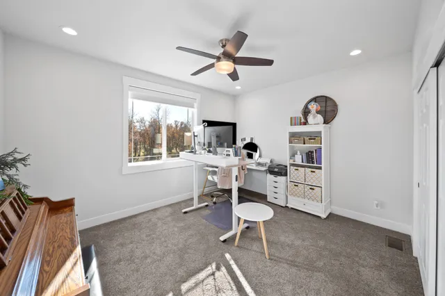 a work room with furniture and windows