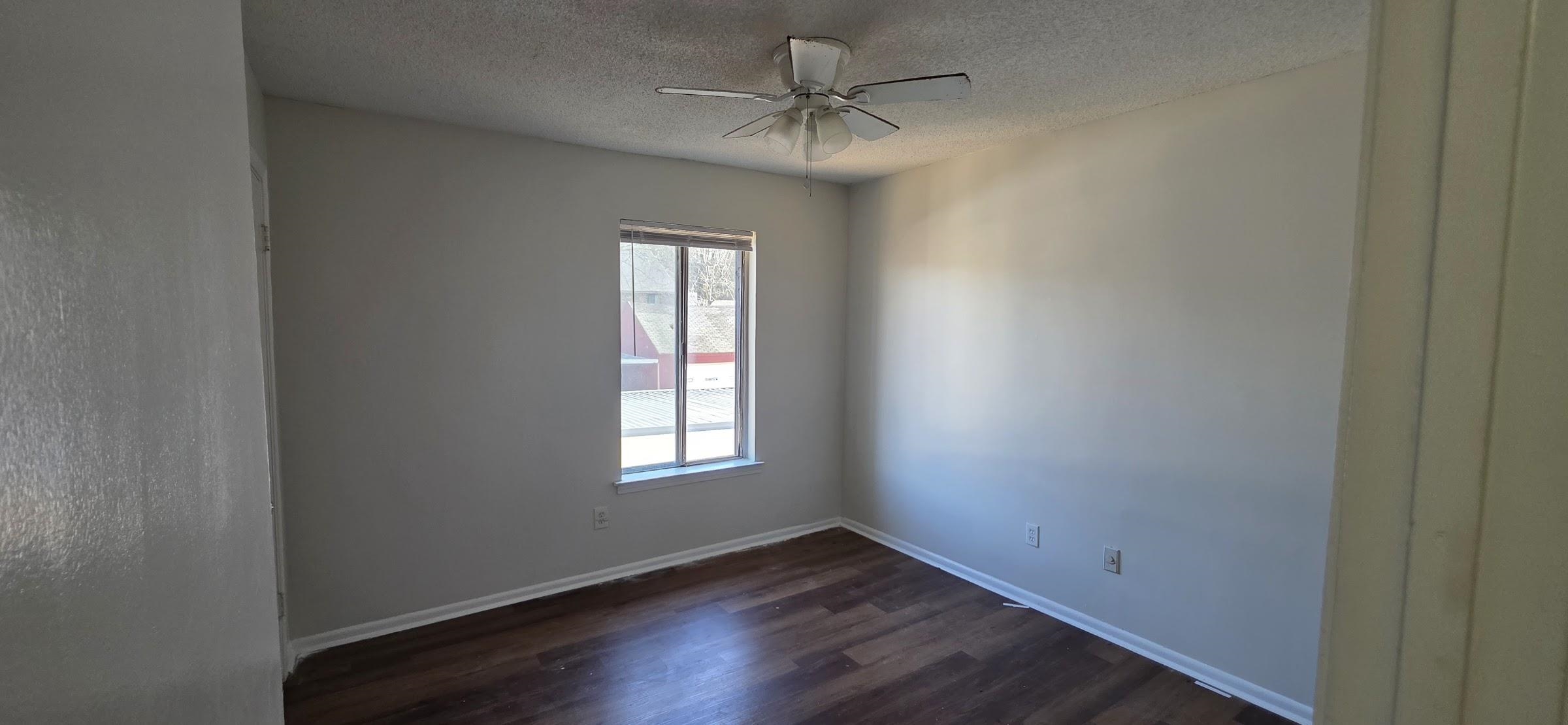 5265 Chatfield Drive, Unit 5265 Memphis, TN 38116 - Photo 8 of 9 an empty room with a window and a fan