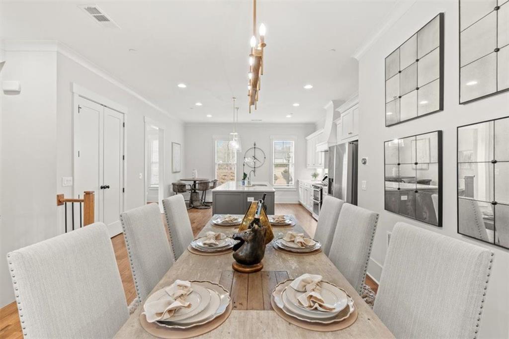 1049 Endeavour Court Marietta, GA 30064 - Photo 13 of 39 a living room with lots of white furniture and a wooden floor