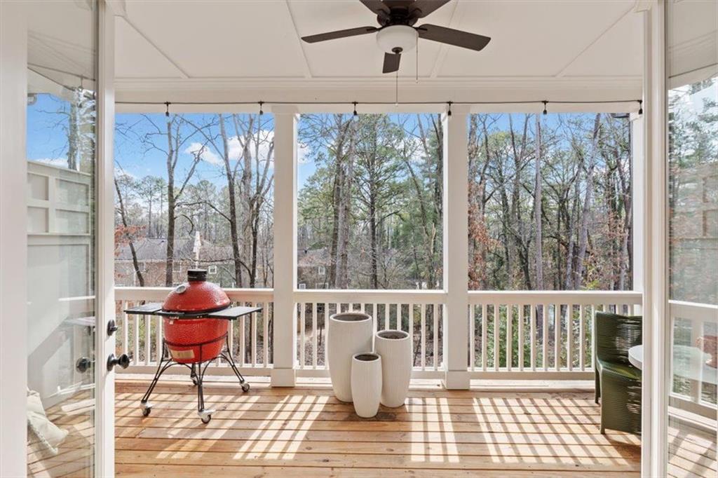 1049 Endeavour Court Marietta, GA 30064 - Photo 18 of 39 a dining room with furniture a chandelier and wooden floor