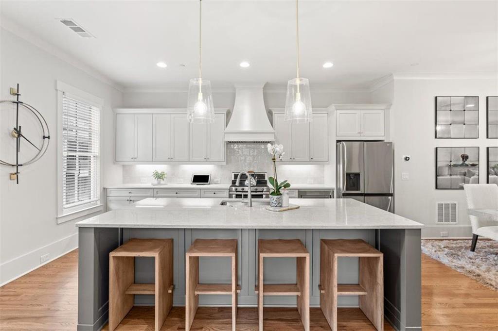 1049 Endeavour Court Marietta, GA 30064 - Photo 2 of 39 a kitchen with kitchen island granite countertop a sink and refrigerator