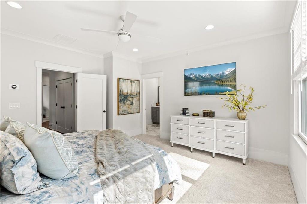 1049 Endeavour Court Marietta, GA 30064 - Photo 22 of 39 a bedroom with a bed and a flat screen tv