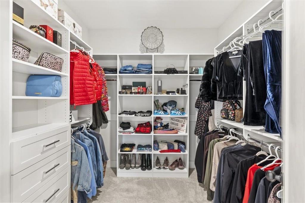 1049 Endeavour Court Marietta, GA 30064 - Photo 25 of 39 a view of walk in closet with clothes and shoes
