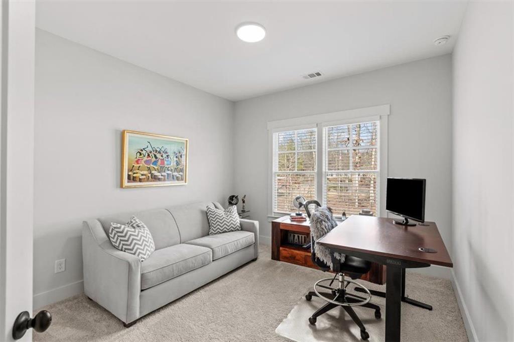 1049 Endeavour Court Marietta, GA 30064 - Photo 26 of 39 a view of a workspace with furniture and a window