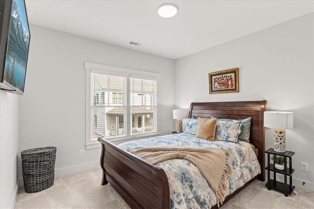 1049 Endeavour Court Marietta, GA 30064 - Photo 27 of 39 a bedroom with bed and window