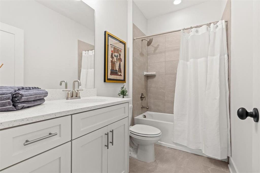 1049 Endeavour Court Marietta, GA 30064 - Photo 28 of 39 a bathroom with a sink a toilet and shower