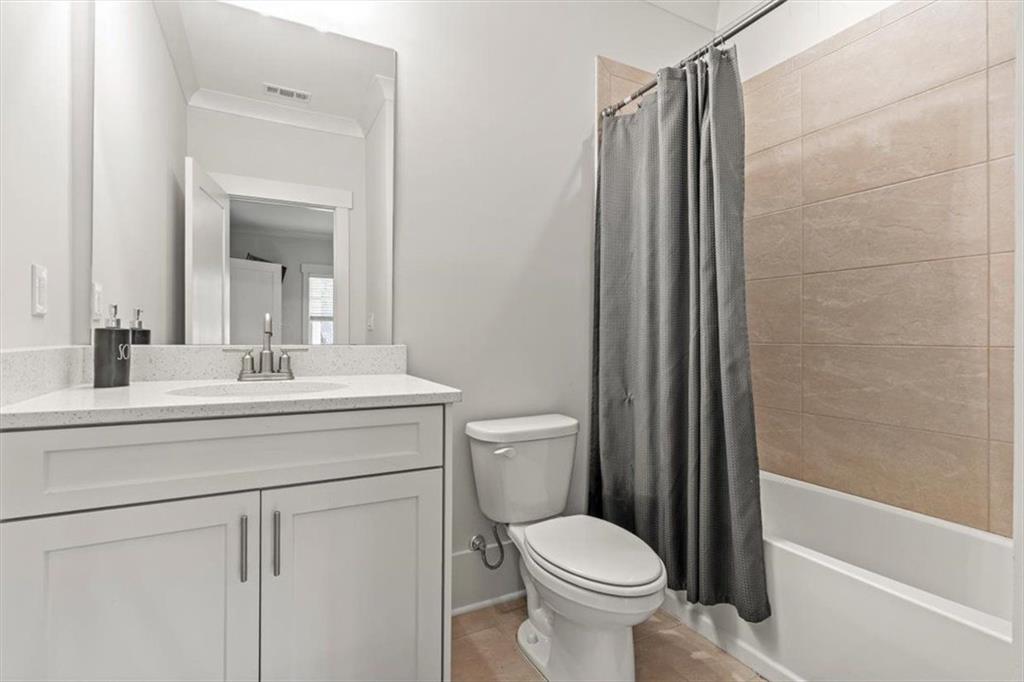 1049 Endeavour Court Marietta, GA 30064 - Photo 30 of 39 a bathroom with a sink a toilet and shower