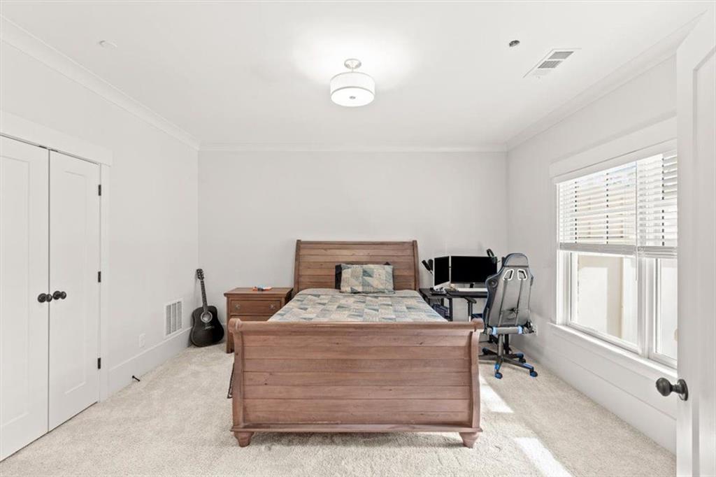 1049 Endeavour Court Marietta, GA 30064 - Photo 32 of 39 a room with a bed and furniture