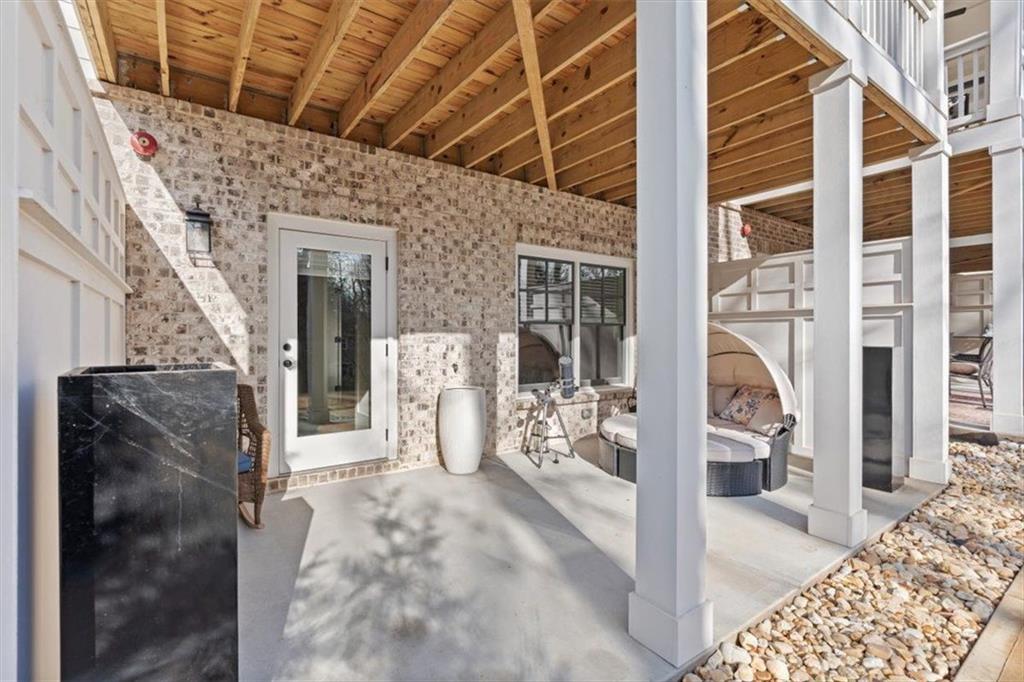 1049 Endeavour Court Marietta, GA 30064 - Photo 34 of 39 a view of a porch with a table and chairs