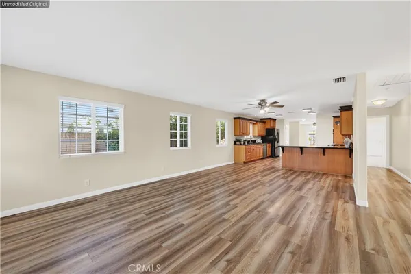 a kitchen with granite countertop a stove and cabinets