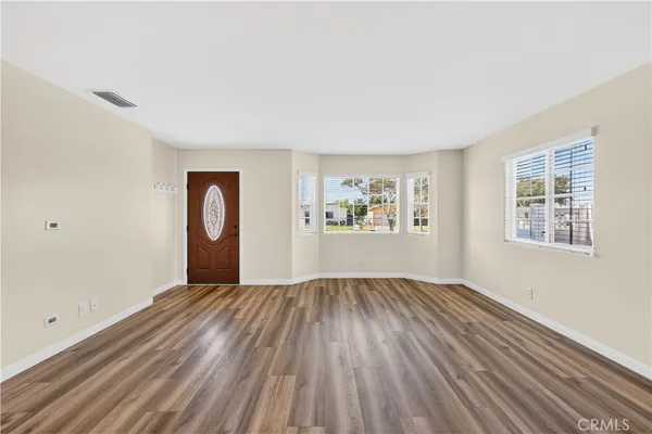 a kitchen with a sink cabinets and a window