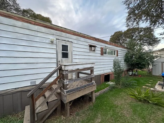 a view of a house with a back yard