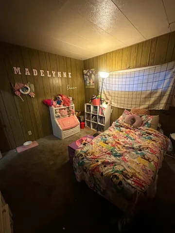 a bedroom with bed and window