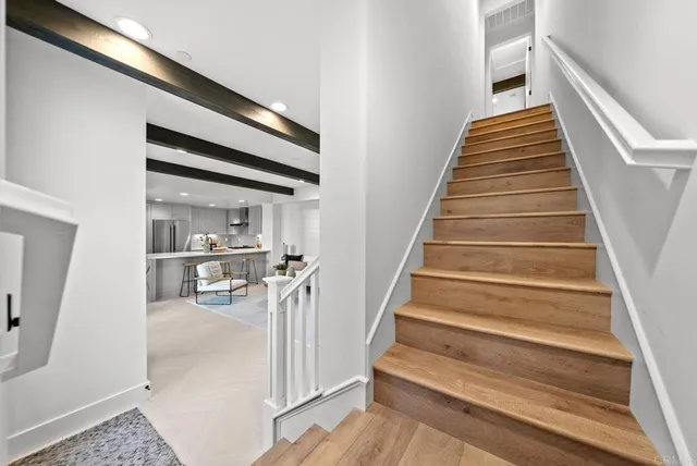 a view of a dining room with furniture and window