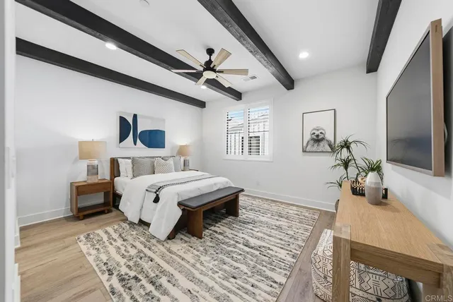 a view of a dining room with furniture and a potted plant