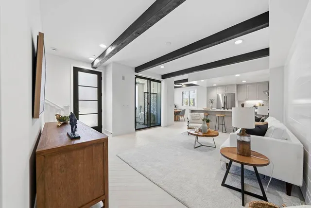 a living room with furniture and a rug