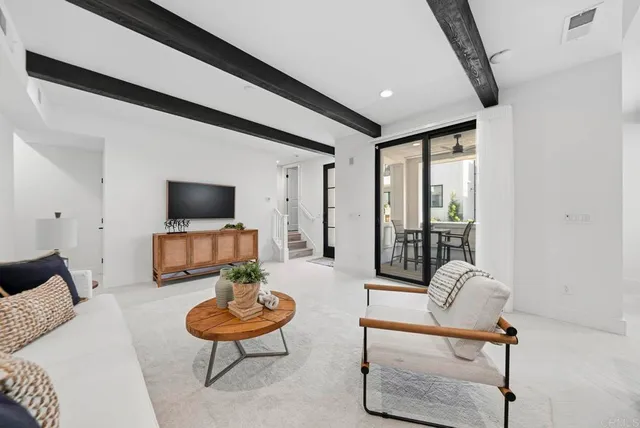 a kitchen with a sink a table and chairs