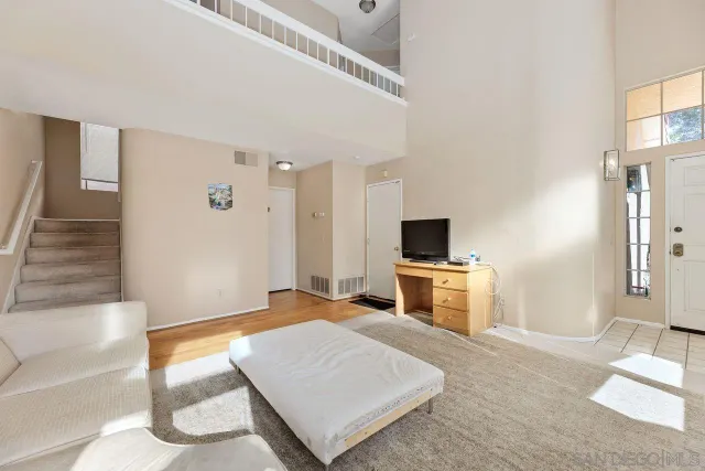 a dining room with furniture a chandelier and a rug