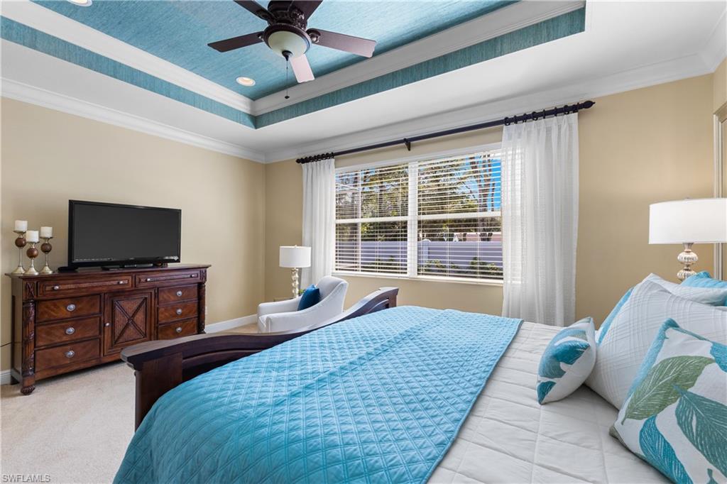 20398 Foxworth Circle Estero, FL 33928 - Photo 12 of 50 a bedroom with a bed and flat screen tv
