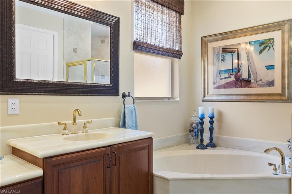 20398 Foxworth Circle Estero, FL 33928 - Photo 14 of 50 a bathroom with a sink and a mirror
