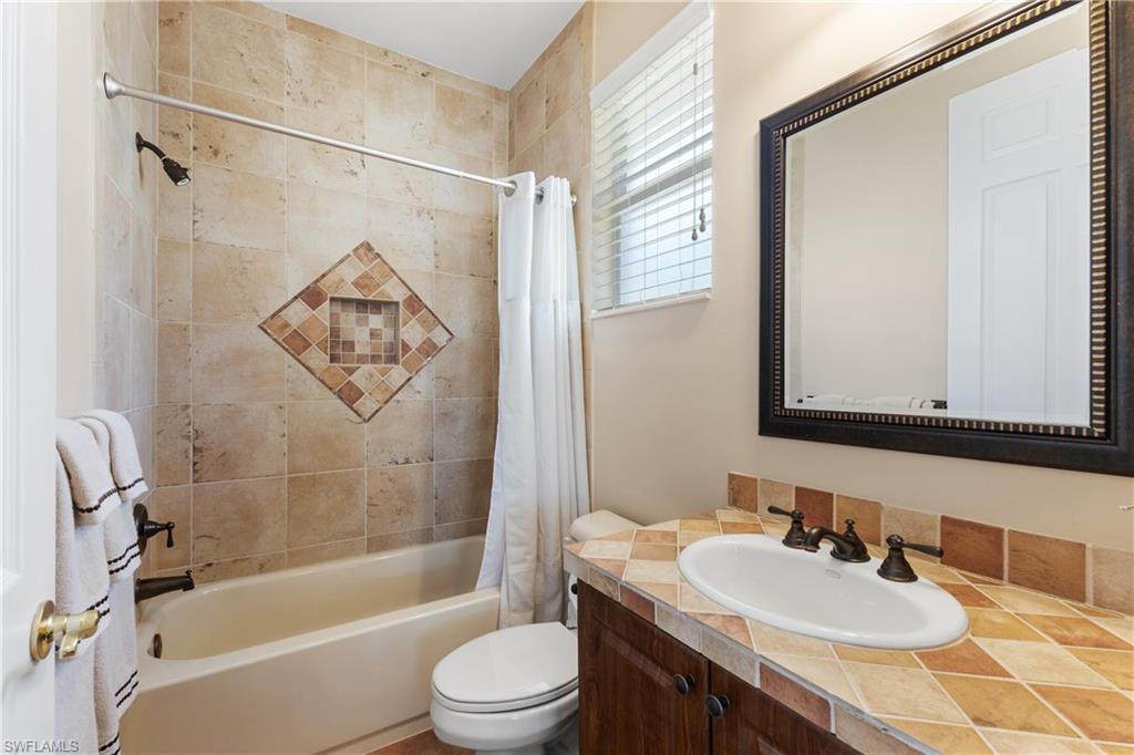 20398 Foxworth Circle Estero, FL 33928 - Photo 17 of 50 a bathroom with a sink toilet and shower
