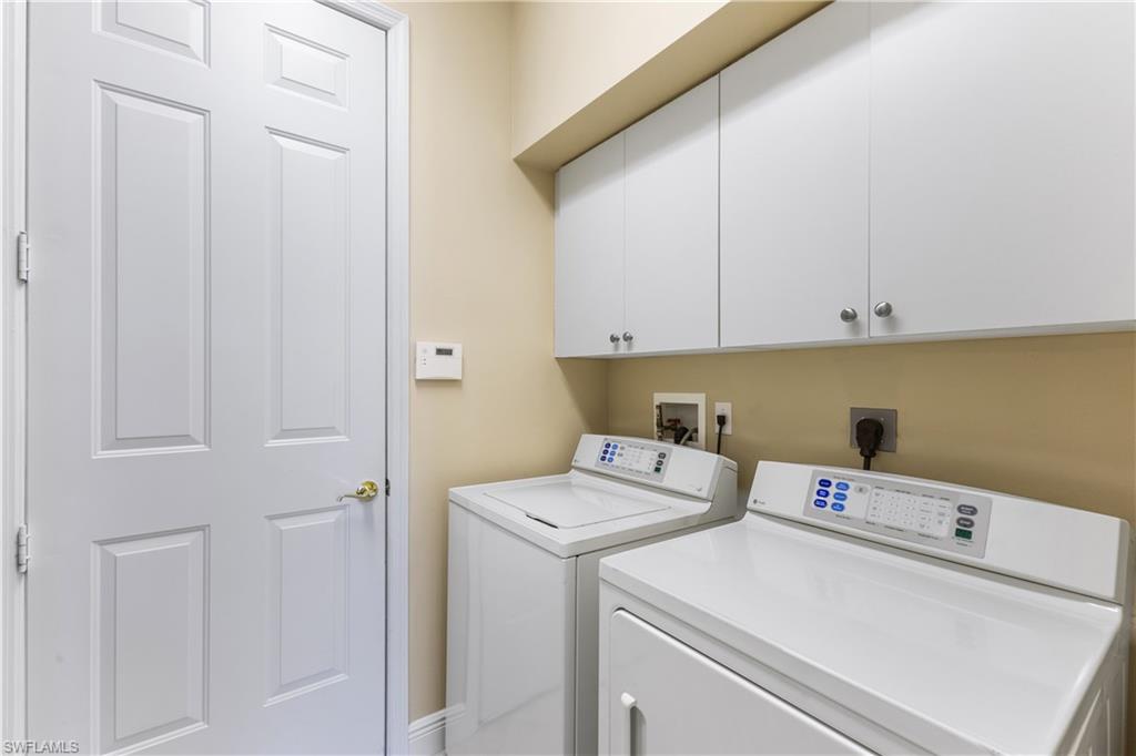 20398 Foxworth Circle Estero, FL 33928 - Photo 18 of 50 a view of storage and utility room with washer and dryer