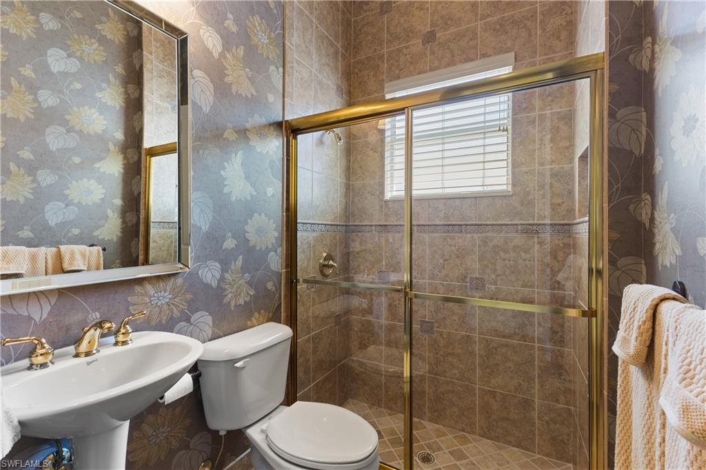 20398 Foxworth Circle Estero, FL 33928 - Photo 19 of 50 a bathroom with a sink toilet and shower