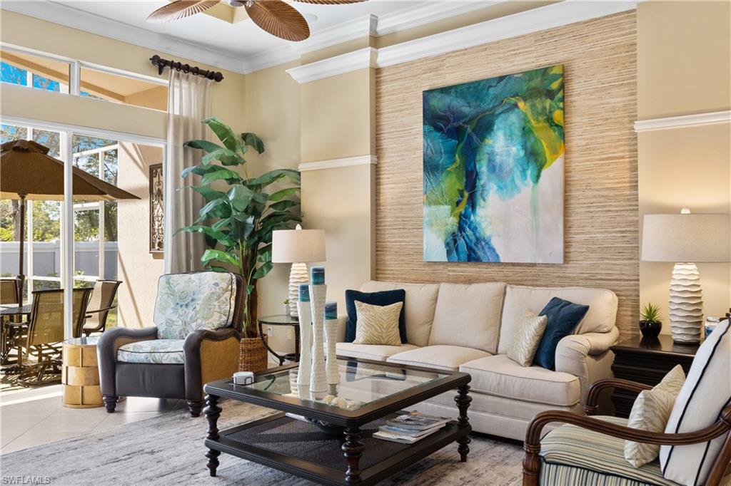20398 Foxworth Circle Estero, FL 33928 - Photo 2 of 50 a living room with furniture and a potted plant