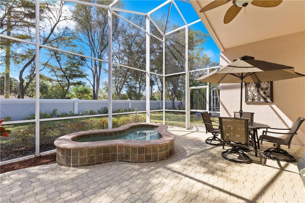 20398 Foxworth Circle Estero, FL 33928 - Photo 21 of 50 a view of a swimming pool with chairs