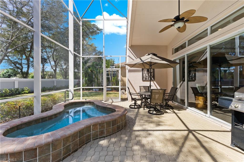 20398 Foxworth Circle Estero, FL 33928 - Photo 22 of 50 a view of living room with patio furniture and a floor to ceiling window