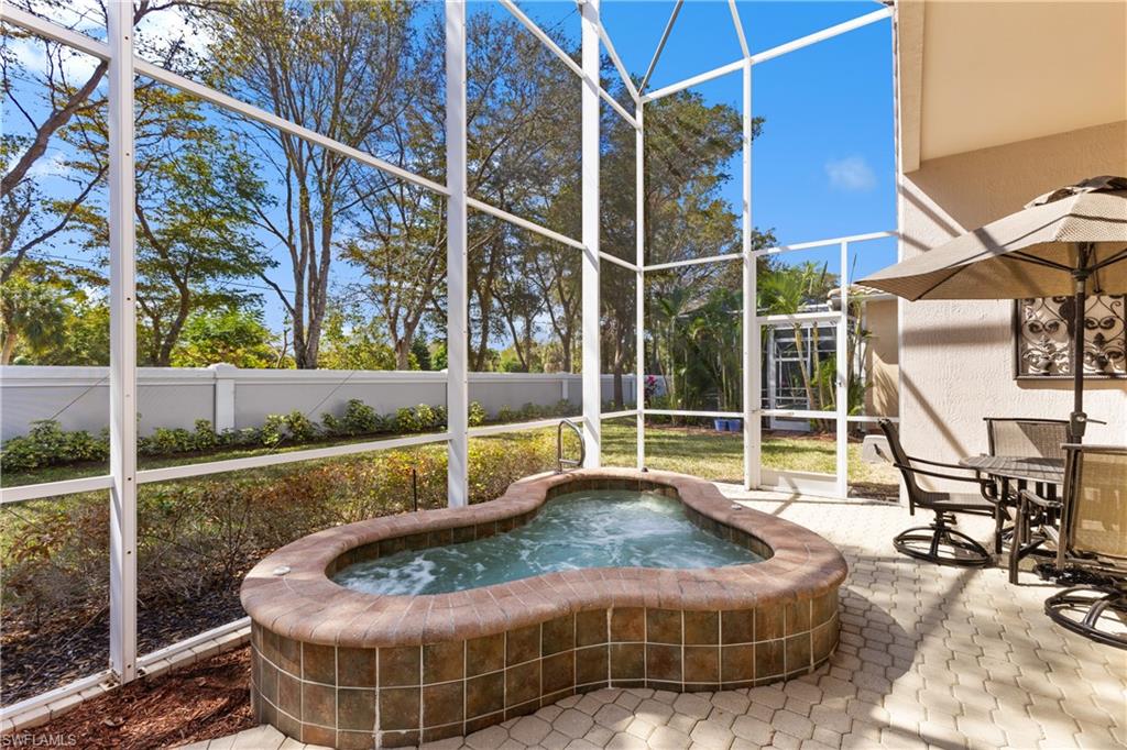 20398 Foxworth Circle Estero, FL 33928 - Photo 25 of 50 a view of a swimming pool with a lounge chair