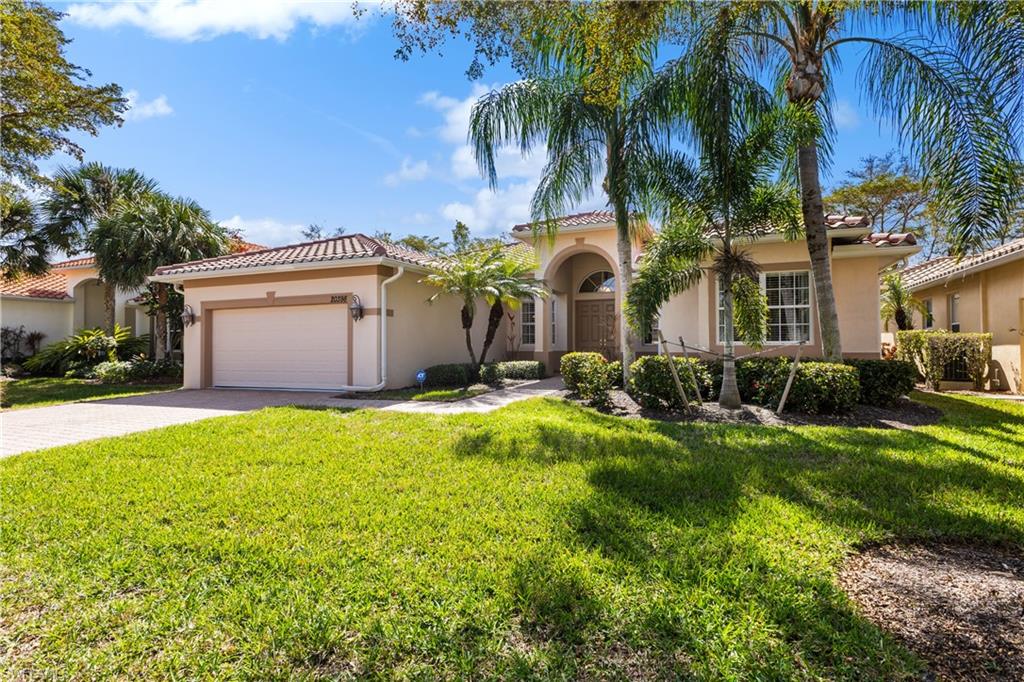 20398 Foxworth Circle Estero, FL 33928 - Photo 35 of 50 a front view of house with yard and green space