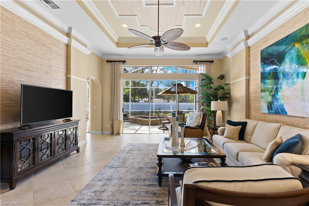 20398 Foxworth Circle Estero, FL 33928 - Photo 4 of 50 a living room with furniture and a flat screen tv