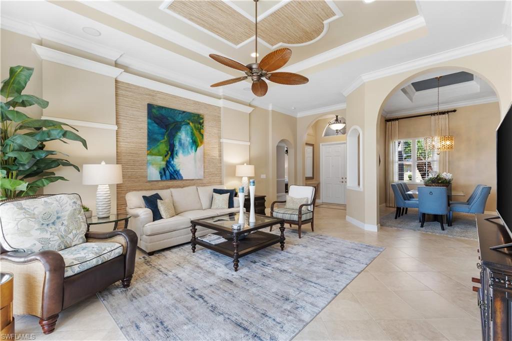 20398 Foxworth Circle Estero, FL 33928 - Photo 6 of 50 a living room with furniture ceiling fan and a rug
