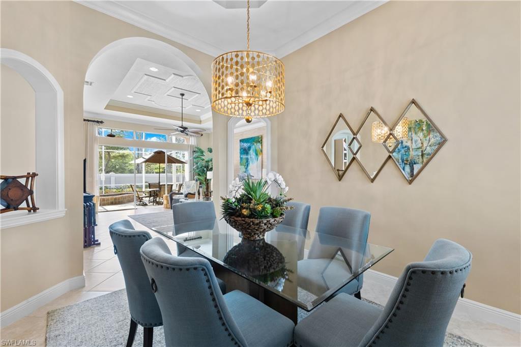 20398 Foxworth Circle Estero, FL 33928 - Photo 8 of 50 a dining room with furniture a chandelier and wooden floor