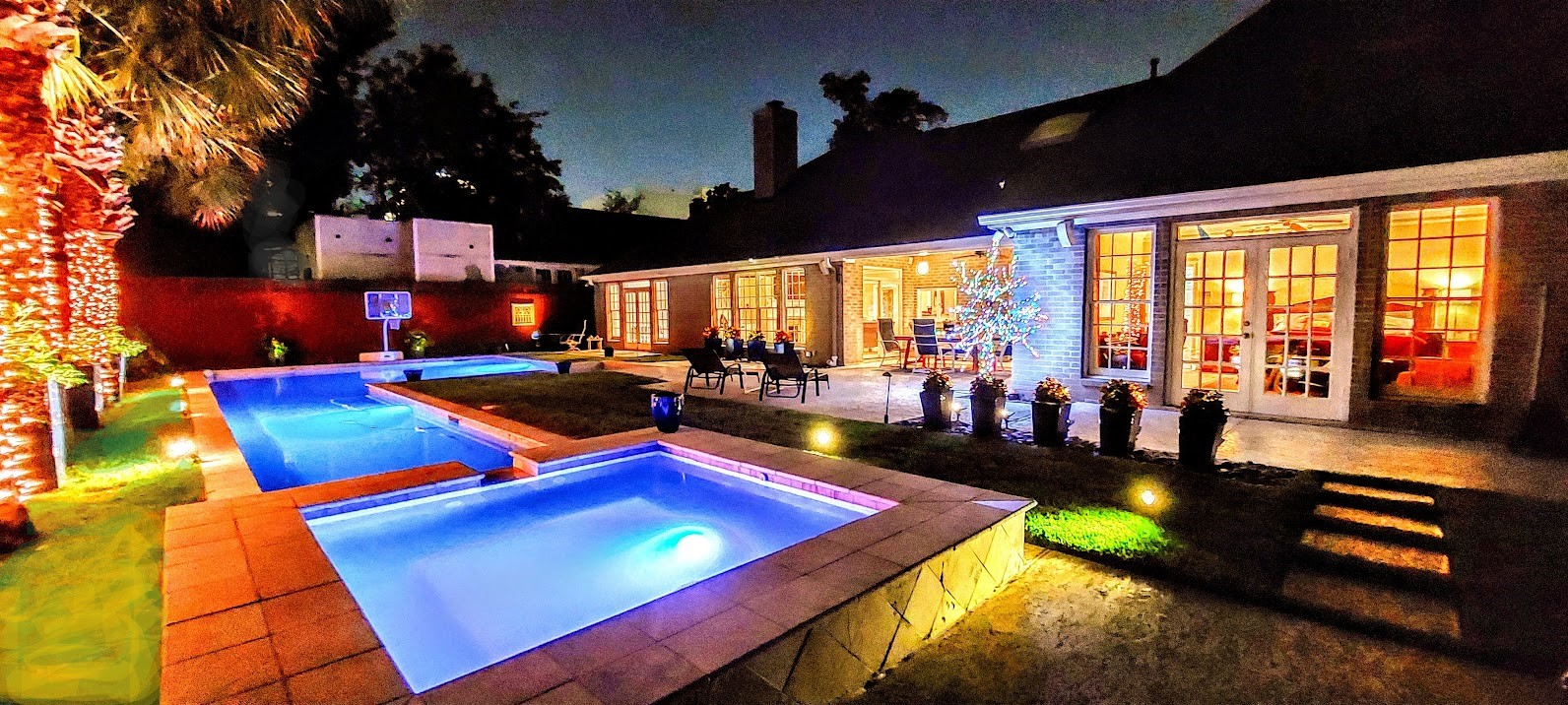 4401 Roseland Street Houston, TX 77006 - Photo 43 of 46 Night time Private Oasis! Notice the covered patio area and the floor to ceiling windows from all rooms facing the pool and backyard!!