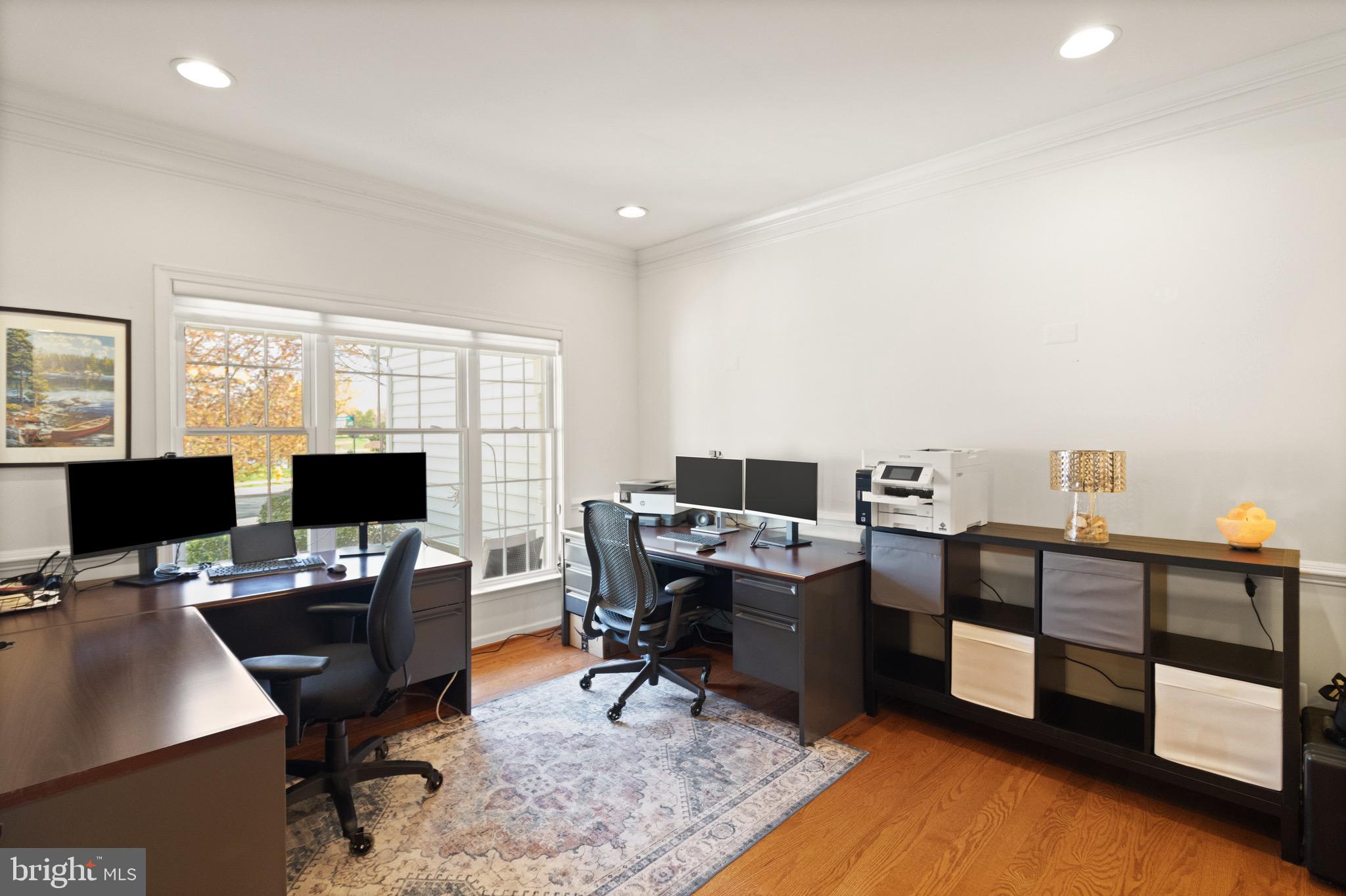 5652 Wheelwright Way Haymarket, VA 20169 - Photo 11 of 32 a view of a workspace with furniture and a window