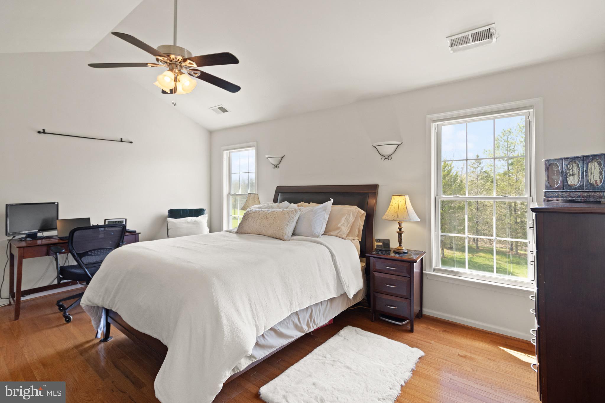 5652 Wheelwright Way Haymarket, VA 20169 - Photo 15 of 32 a bed room with a bed and a chandelier