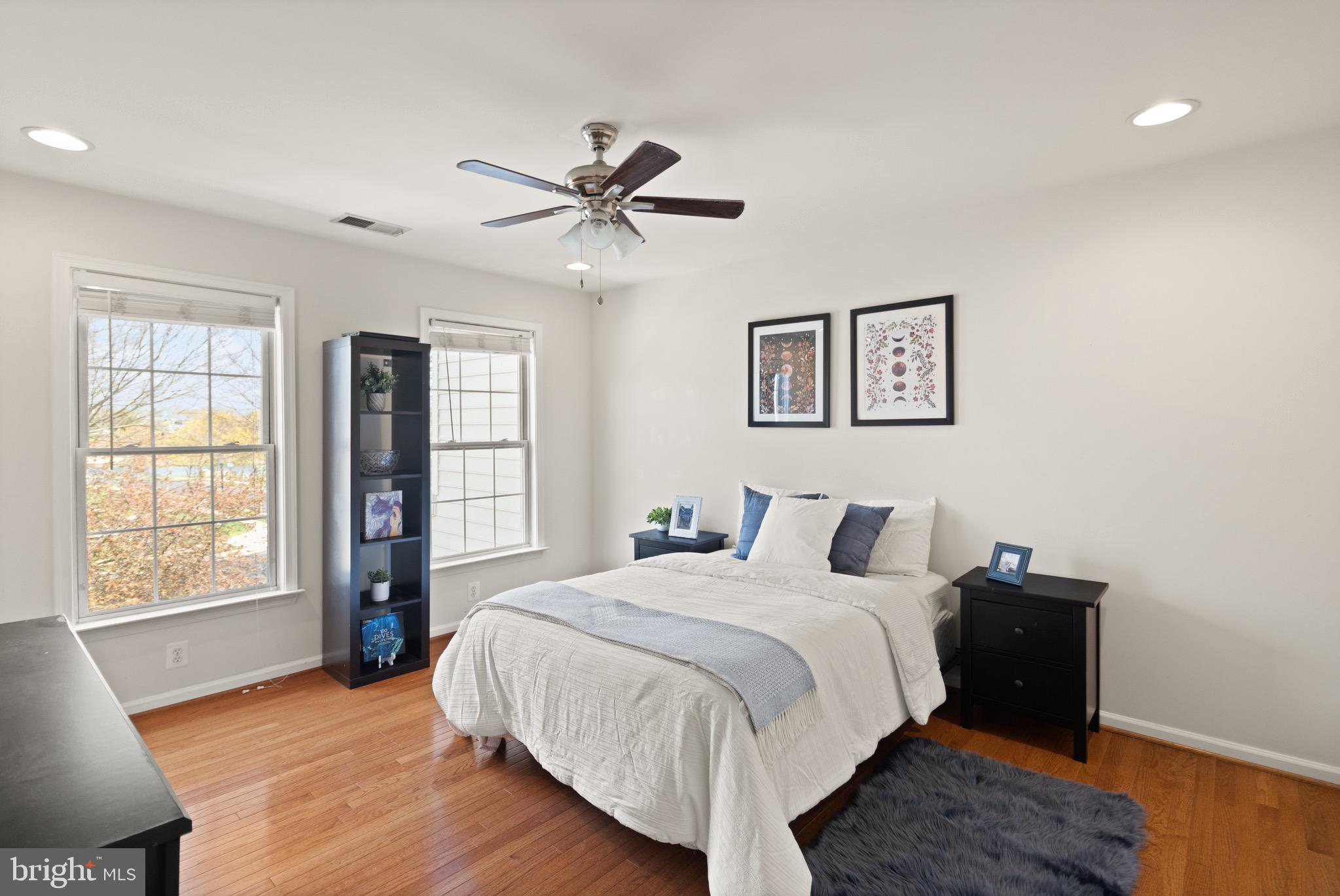 5652 Wheelwright Way Haymarket, VA 20169 - Photo 19 of 32 a bedroom with a large bed and a window