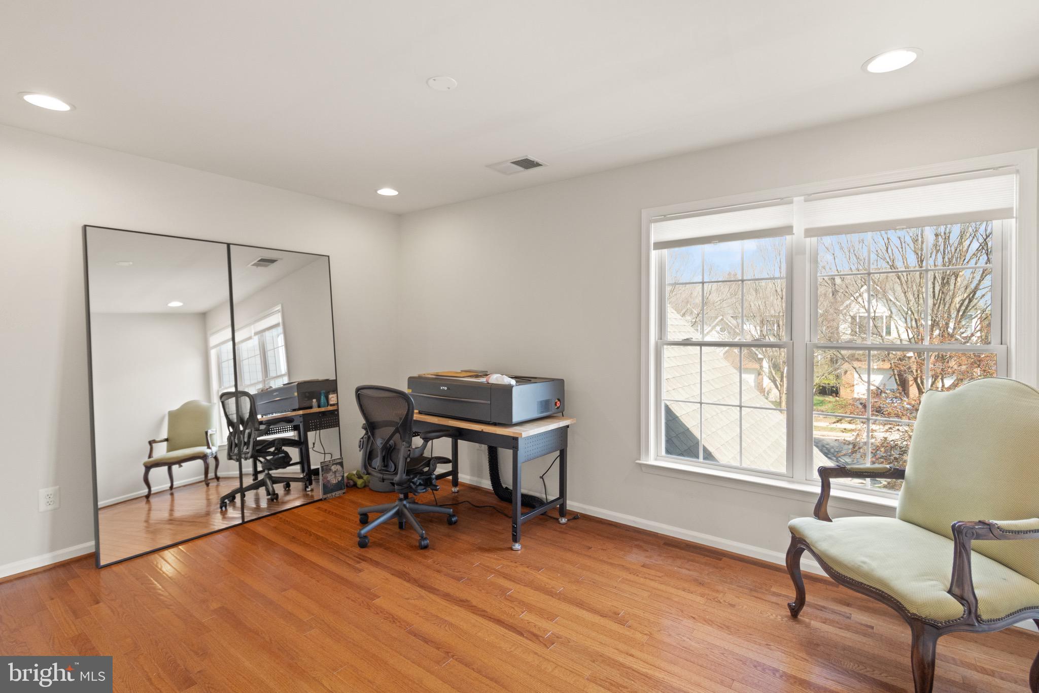 5652 Wheelwright Way Haymarket, VA 20169 - Photo 21 of 32 a view of a workspace with furniture and a window
