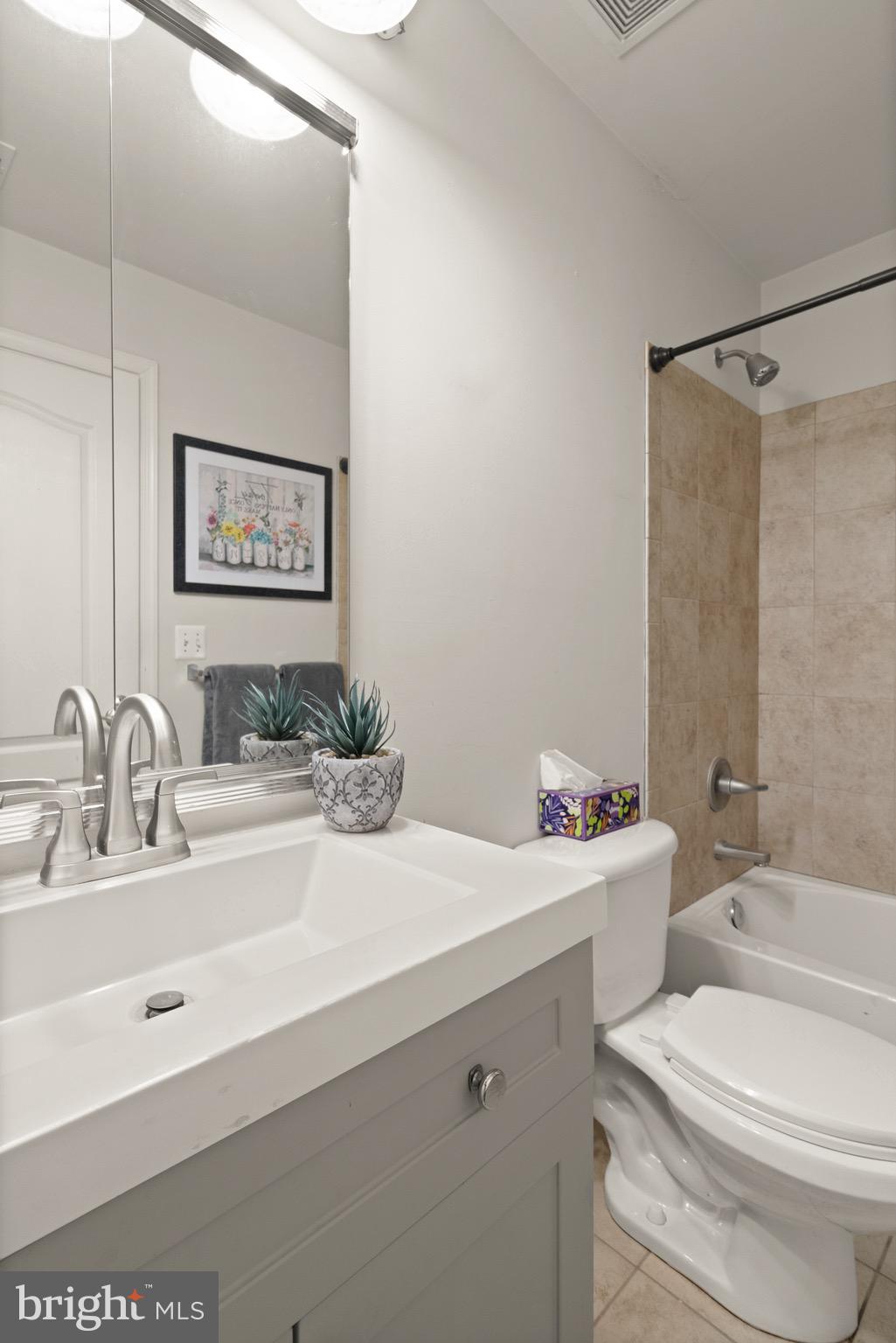 5652 Wheelwright Way Haymarket, VA 20169 - Photo 23 of 32 a bathroom with a sink a toilet and shower