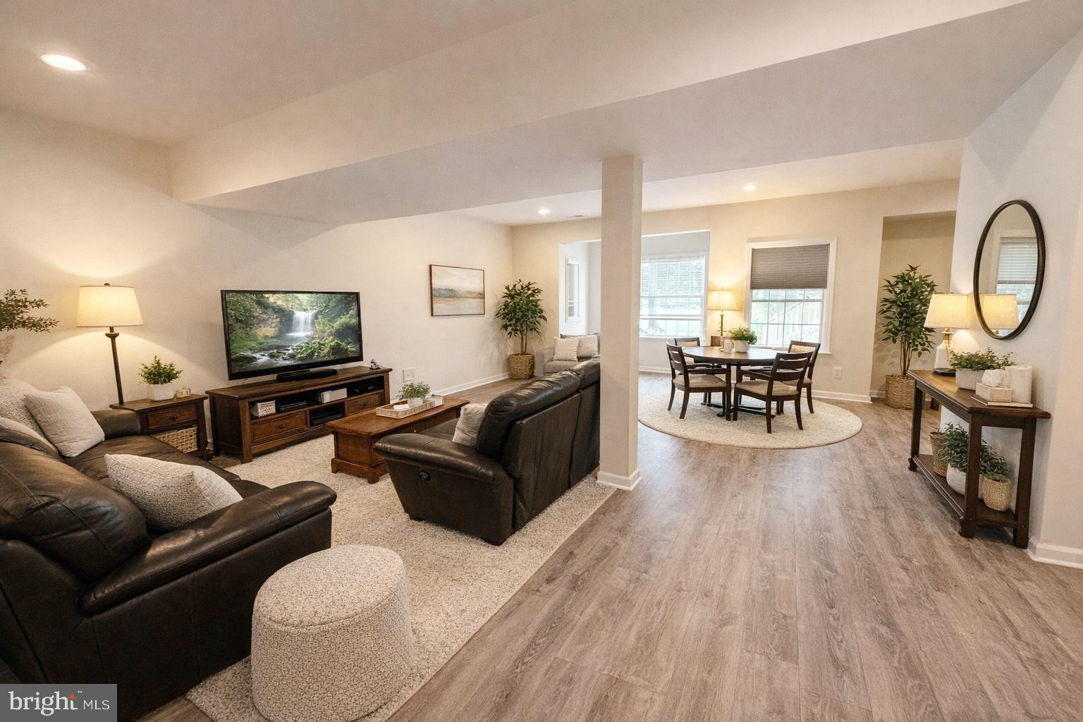 5652 Wheelwright Way Haymarket, VA 20169 - Photo 24 of 32 a living room with furniture and a flat screen tv