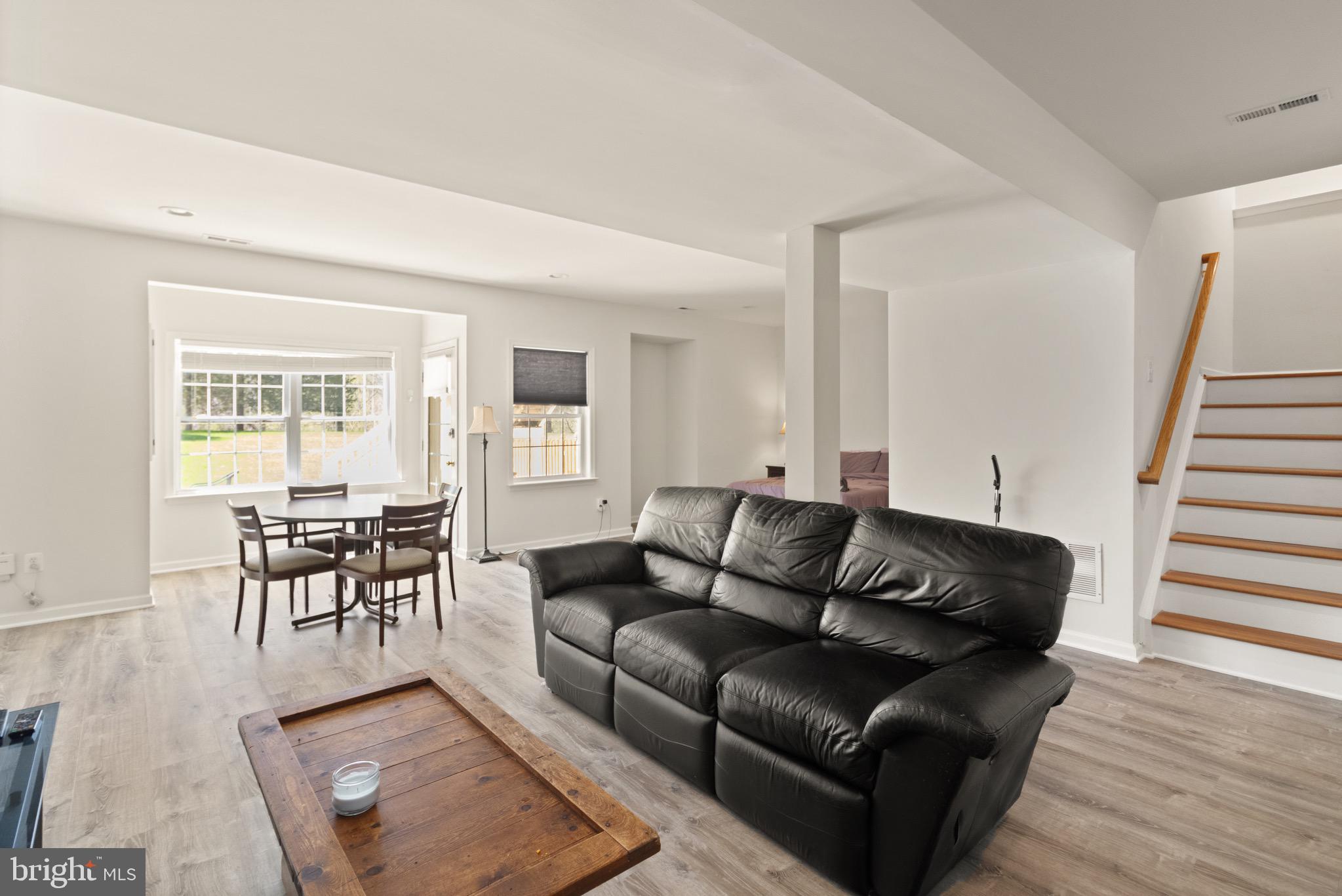 5652 Wheelwright Way Haymarket, VA 20169 - Photo 26 of 32 a living room with furniture and a wooden floor